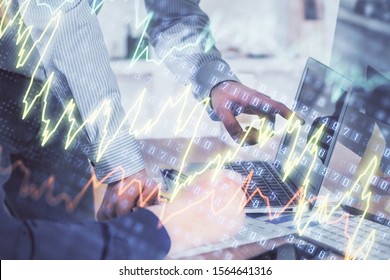 Double exposure of graph with man typing on computer in office on background. Concept of hard work. Closeup. - Shutterstock ID 1564641316