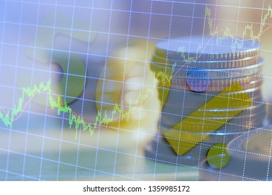 Double exposure of graph and rows of coins for finance and business concept, 50%