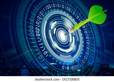 Double exposure of green darts on center of virtual screen of dartboard with cityscape background