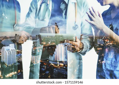 Double Exposure Group Of Happy Doctor Surgeon And Nurse With Tablet In Meeting On City Night Background, Healthcare And Medical Concept
