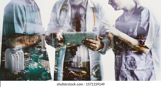 Double Exposure Group Of Happy Doctor Surgeon And Nurse With Tablet In Meeting On City Night Background, Healthcare And Medical Concept
