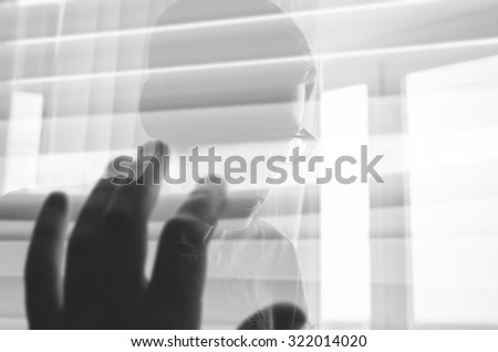 Similar – Desperate man hides eyes behind his hand