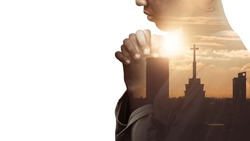 Double Exposure Of A Hand Girl Praying For City, Hands Folded In Prayer Concept For Faith, Spirituality And Religion, Church In The City With Sky Background.