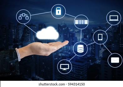 Double exposure hand of professional businessman connected internet and wireless network with his smart phone and city of business background in business trading and technology concept