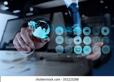 double exposure of hand showing Internet of things (IoT) word diagram as concept - Shutterstock ID 331223288