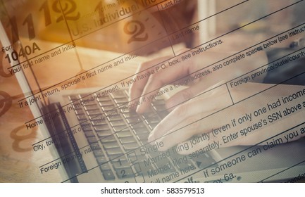 Double Exposure hand typing laptop with US tax form and clock/ taxation concept