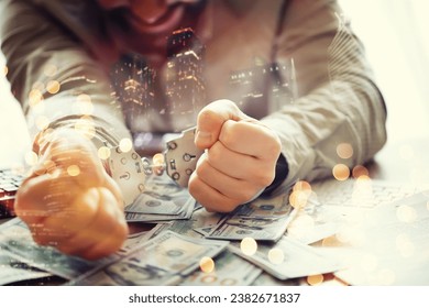 Double exposure .Hands of a fraudster with handcuffs on a background of us dollars and credit cards. Fraud, cyber crime concept. credit card fraud. Arrest of an entrepreneur in the workplace.
