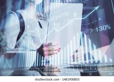 Double exposure of hands making notes with forex chart huds. Stock market concept.
