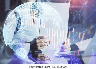 Double exposure of hands making notes with forex chart huds. Stock market concept.