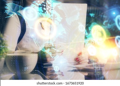 Double exposure of hands making notes with forex chart huds. Stock market concept.