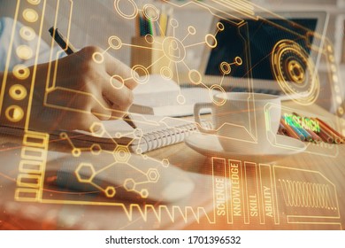 Double exposure of hands making notes with digital coding icons. Computer learning concept.