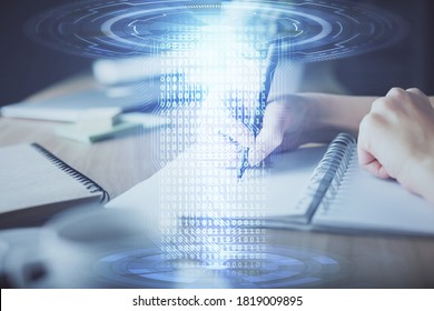 Double exposure of hands making notes background with technology and digital coding huds. Data learning concept.