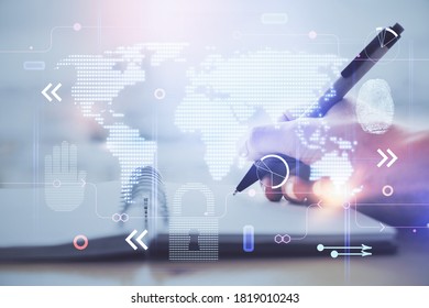 Double exposure of hands making notes with world map hologram and data theme icons. Concept of global computer data.