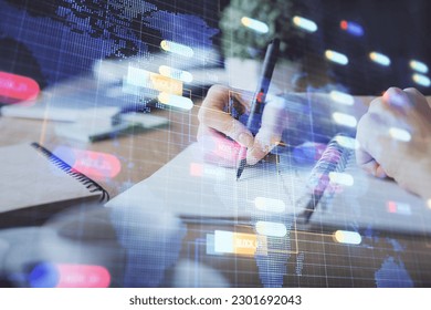 Double exposure of hands making notes background with technology and digital coding huds. Data learning concept.