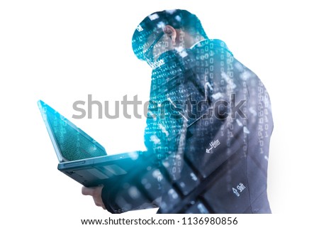 The double exposure image of the business man using a laptop computer during sunrise overlay with computer's keyboard image. The concept of modern life, business, city life and internet of things.