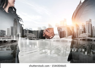 Double exposure image of business people handshake on city office building in background showing partnership success of business deal. Concept of corporate teamwork, trust partner and work agreement. - Shutterstock ID 1544304665