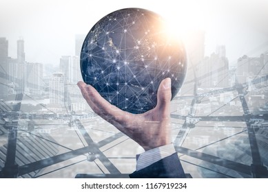 The double exposure image of the businessman hold the virtual hologram on hand and element of this image furnished by Nasa. the concept of communication network, internet of things and future life - Shutterstock ID 1167919234