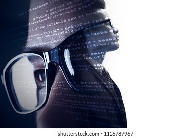 The double exposure image of the businessman standing overlay with source code and programmer image and copy space. The concept of programming, cyber security, business and internet of things.