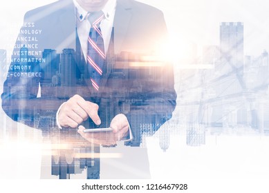 The double exposure image of the businessman using a smartphone during sunrise overlay with cityscape image. The concept of modern life, business, city life and internet of things. - Powered by Shutterstock