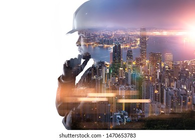 The double exposure image of the engineer thinking overlay with cityscape image and. The concept of engineering, construction, city life and future.