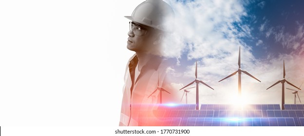 double exposure image of the engineer thinking overlay with solar panels and wind turbines and blue sky with clouds,sunset background of photovoltaic modules.Green energy and clean energy concept