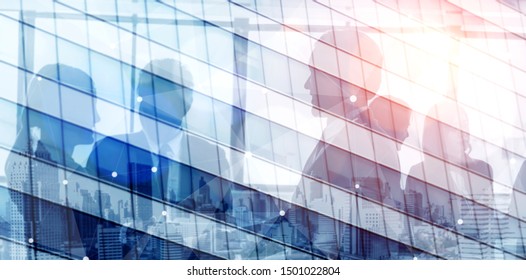 Double exposure image of faded business abstract background with office building and people conference group meeting showing partnership success of business deal.