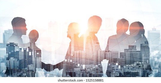 Double exposure image of many business people conference group meeting on city office building in background showing partnership success of business deal. Concept of teamwork, trust and agreement.
