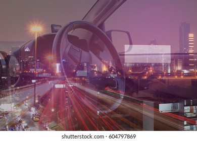 Double Exposure Of Inside Car Console And Cityscape On Night Time Background