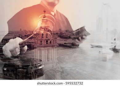 Double exposure of justice and law concept.Male judge in a courtroom with the gavel and working with holy book and brass scale on wood table with London city - Powered by Shutterstock