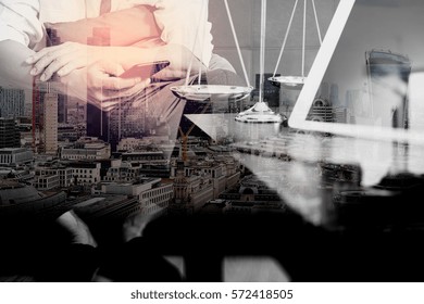 Double Exposure Of Justice And Law Context.Male Lawyer Hand Sitting On Sofa And Working With Smart Phone,digital Tablet Computer Docking Keyboard On Living Table At Home,London Architecture City