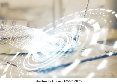 Double exposure of laptop computer and technology theme hologram. Concept of freelance work.