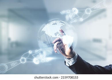 Double exposure of male hand clicks on abstract virtual robotics technology with world map hologram on blurred office background. Research and development software concept