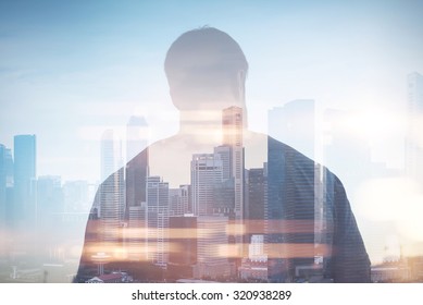 Double Exposure Of Man And City On The Background