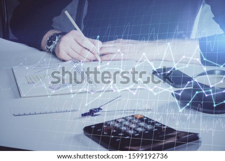 Double exposure of man doing analysis of stock market with forex graph.