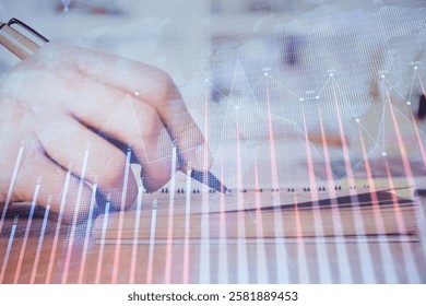 Double exposure of man doing notes of stock market with forex graph. Concept of research and trading.