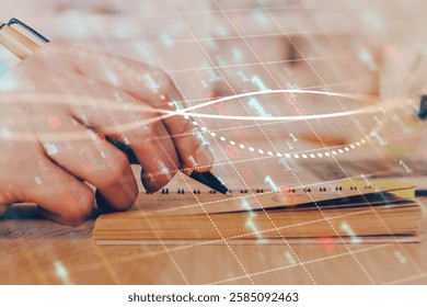 Double exposure of man doing notes of stock market with forex graph. Concept of research and trading.