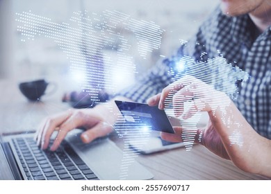 Double exposure of man hands holding a credit card and social network theme drawing. Digital finance and E-commerce concept.