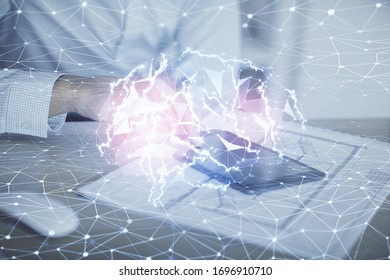 Double exposure of man's hand holding and using a digital device and brain hologram drawing. Data concept.