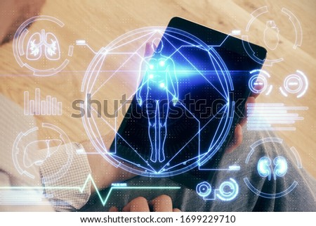 Double exposure of man's hands holding and using a phone and education theme drawing.