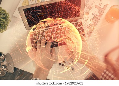 Double exposure of man's hands typing over computer keyboard and social network theme hologram drawing. Top view. People connection web concept.