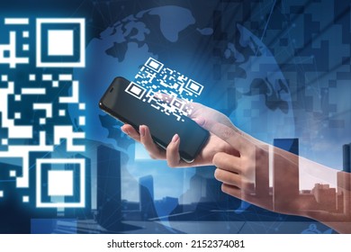 Double exposure of modern city and female hands holding smartphone with QR code on screen