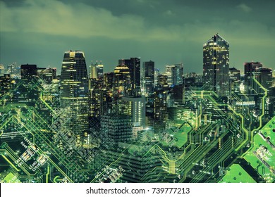 Double exposure of modern cityscape and electric circuit.