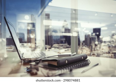 Double Exposure Of Office Workplace With Laptop And Smart Phone On Wood Table