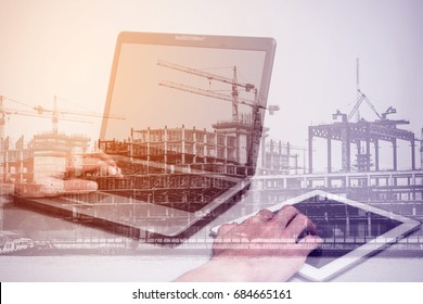 Double Exposure One Using Laptop Computer And Touch Tablet Pc And Construction Site Representing Modern Engineering And Technology Concept.