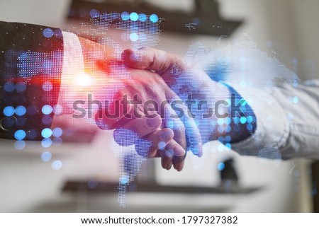 Double exposure of people handshake background and world map hologram. Inernational connection.