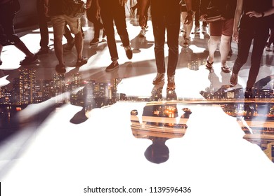 Double Exposure Of People Walking And Nightscape Of Harbor City Representing Urban Life.