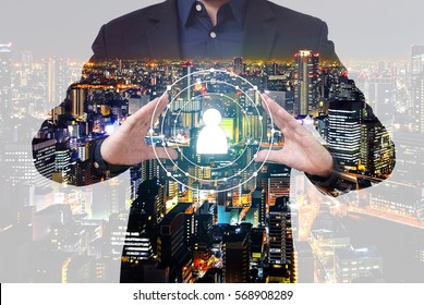 Double exposure of personnel development concept - businessman show person symbol between hands with city overlay
