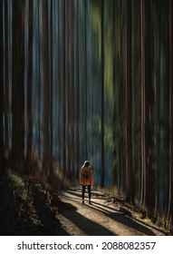 Double Exposure Photography With ICM Technique, Intentional Camera Movement. Woman With Yellow Coat In The Forest. Concept Of Vertigo, Fear, Overcoming, Tranquillity. Motion Blur.