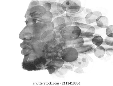 A Double Exposure Portrait Of An African American Man Combined With Watercolor Spots.