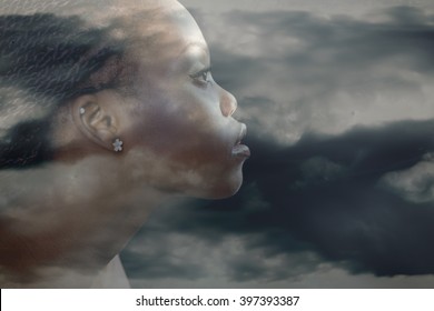 Double Exposure Portrait Of Beautiful Woman. Beauty Portrait Of Young African Woman In Profile With Storm Cloudy Sky